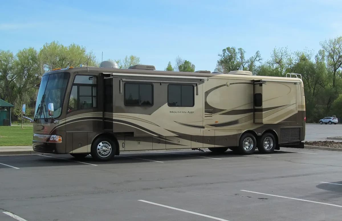 Side profile of a large Class A diesel motorhome